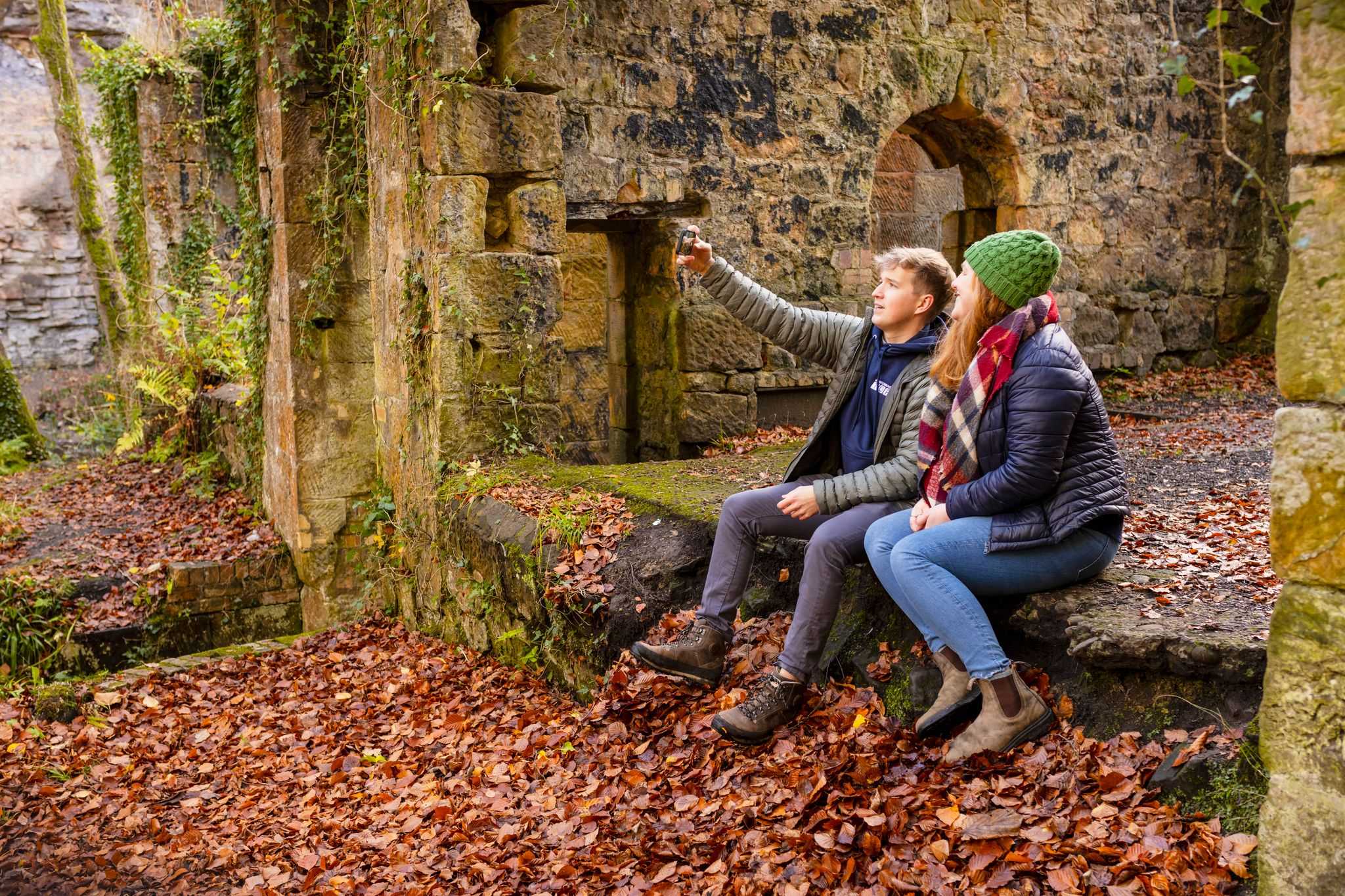 A couple at the side of Gunpowder Mill in Roslin Glen