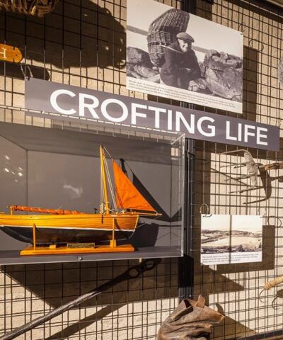 A close up of a display titled Crofting Life on the walls of Gairloch Museum